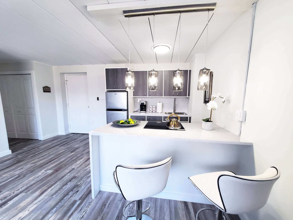 Shorewood Apartments, Cleveland, OH: kitchen island with breakfast bar seating and pendant lighting